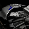 2025 Yamaha YZF-R1M detail. Fuel tank, logo, and handlebars of the sport motorcycle.