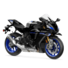 2025 Yamaha YZF-R1M sportbike. Black motorcycle with blue accents, silver tank, and a sporty design.