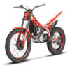 The 2023 EVO 250 2T is a red and silver trials motorcycle with knobby tires, a slim design, exposed parts, and is powered by a 250 2T engine.