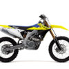 Side view of the SUZUKI RM-Z450 motocross bike in yellow and blue, featuring knobby tires.