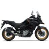 Side view of a SUZUKI V-STROM 650XT motorcycle in black, featuring gold-rimmed wheels, labeled "Suzuki" on the body, and equipped with a clear windshield.