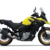Side view of a SUZUKI V-STROM 650XT motorcycle in yellow and black, featuring gold rims and a windshield.