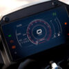 Close-up of the CFMOTO 650 GT ABS digital motorcycle dashboard with a circular speedometer, odometer showing 1 km, and fuel gauge on a black screen displaying vibrant multi-colored indicators.