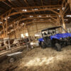 2024 Yamaha Viking VI UTV in a barn. Utility vehicle is blue.