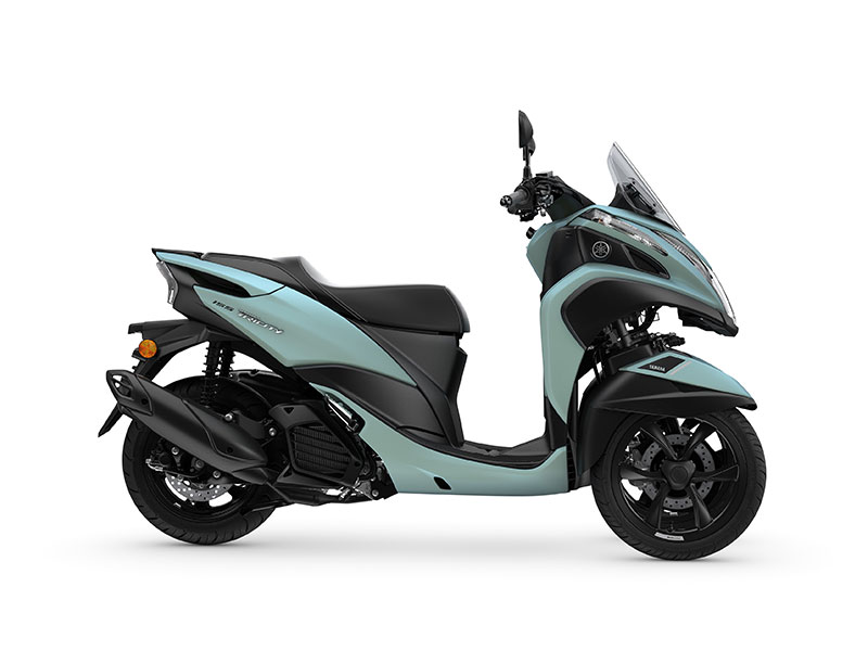 The 2024 YAMAHA TRICITY 155 is a light blue and black three-wheeled scooter with a sleek windshield, elegantly displayed in side profile against a pristine white background.