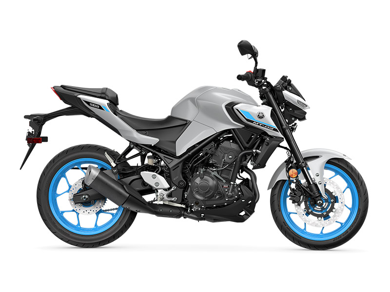 A right-side view of the YAMAHA MT-03 LAMS 2025 in gray and black with blue-accented wheels against a white backdrop.