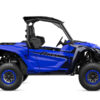 A blue YAMAHA WOLVERINE RMAX2 1000 SPORT off-road utility vehicle with large tires and open seating for two.