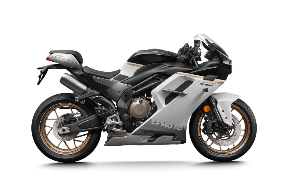 Side view of the CFMOTO 500SR VOOM sport motorcycle, featuring a black, white, and silver body with gold wheels and aerodynamic fairings.