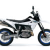 The SUZUKI DR-Z 4SM, a white supermoto motorcycle with blue-rimmed wheels, is displayed in profile against a plain white background.